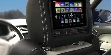 GPS navigation system embedded in a vehicle's headrest for in-car entertainment.